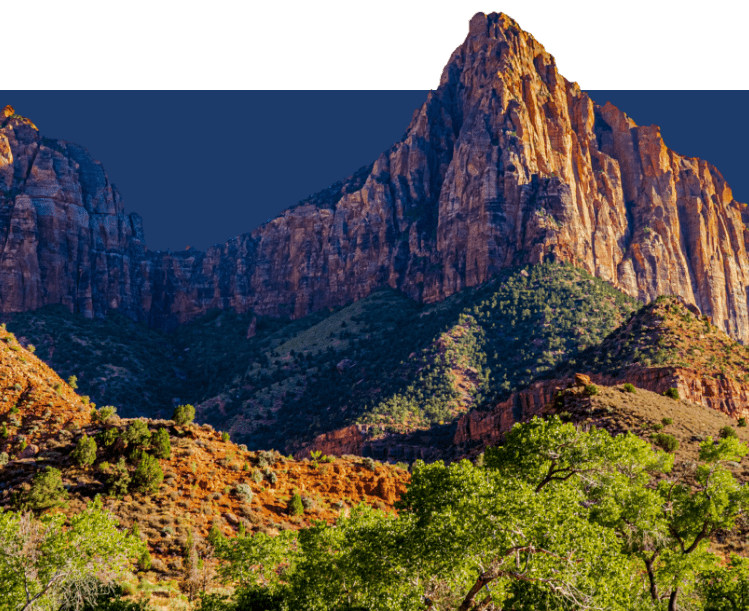 Steep cliffs surround the valley, towering over it with rugged rock formations